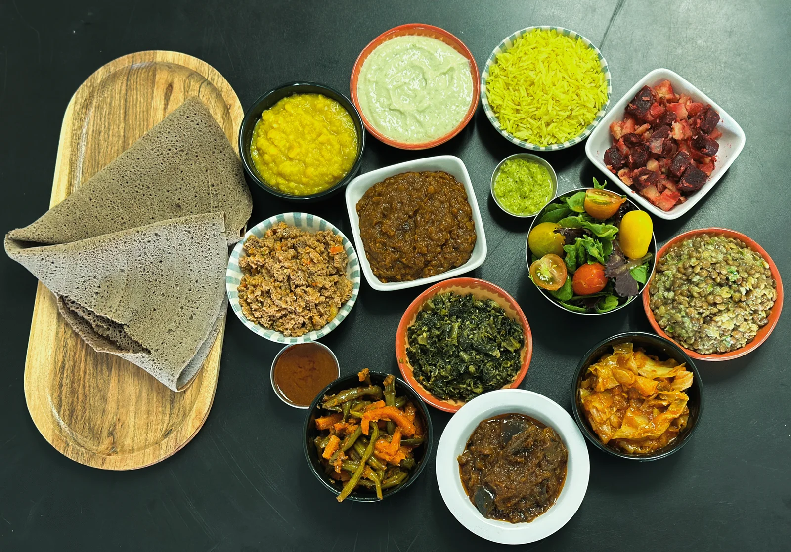 GIHON's colorful Ethiopian platter with injera and vegetable dishes